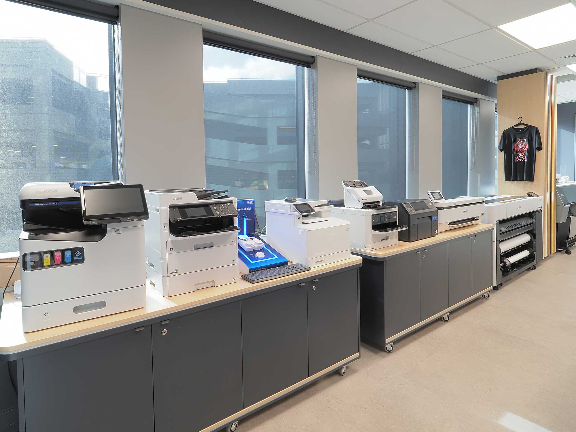 Auckland experience centre showing a large format printer and projectors projecting Epson NZ on a wall
