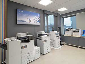 Auckland experience centre showing a large format printer and projectors projecting Epson NZ on a wall
